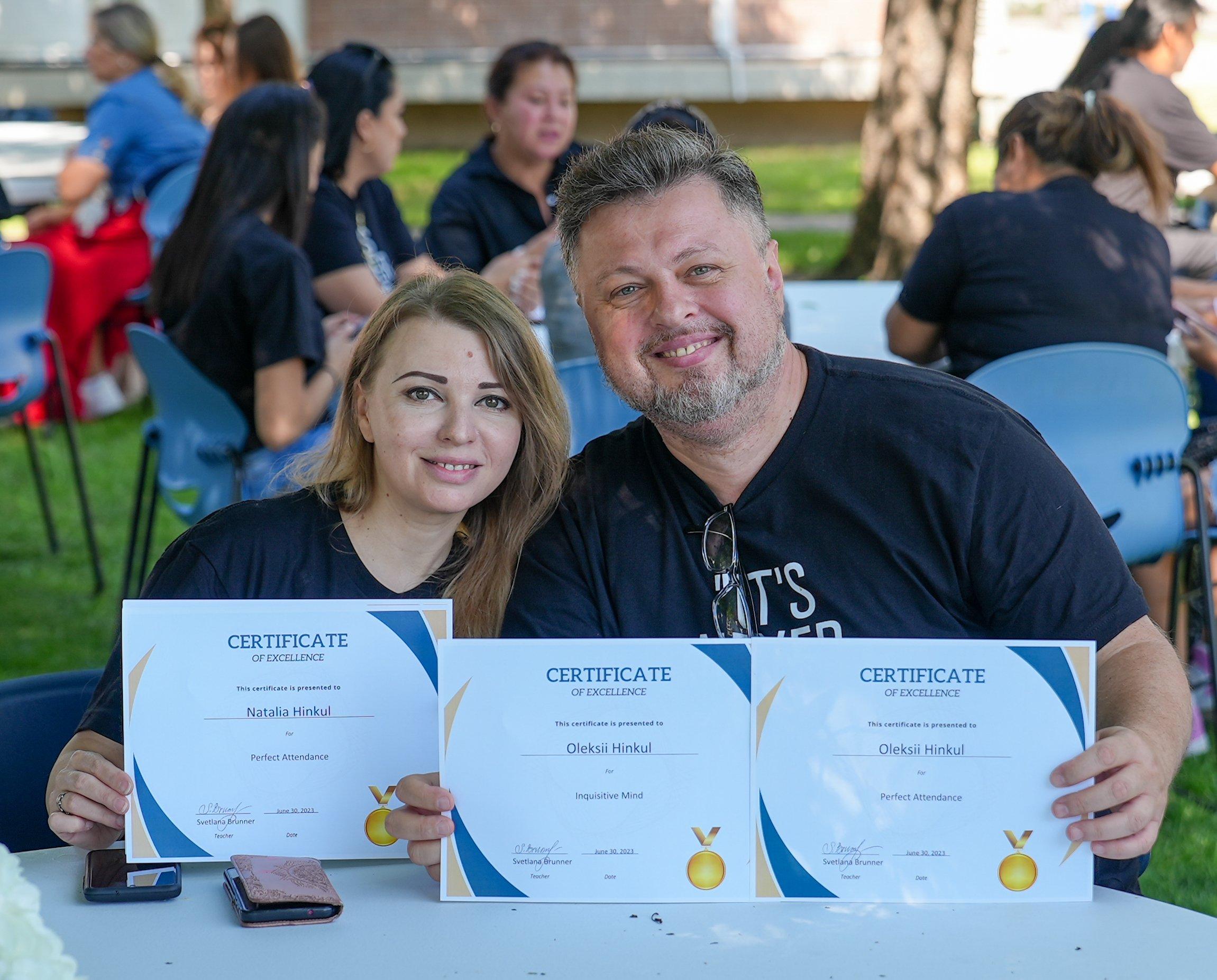 HCCTS students and staff standing together outdoors while displaying certificates.